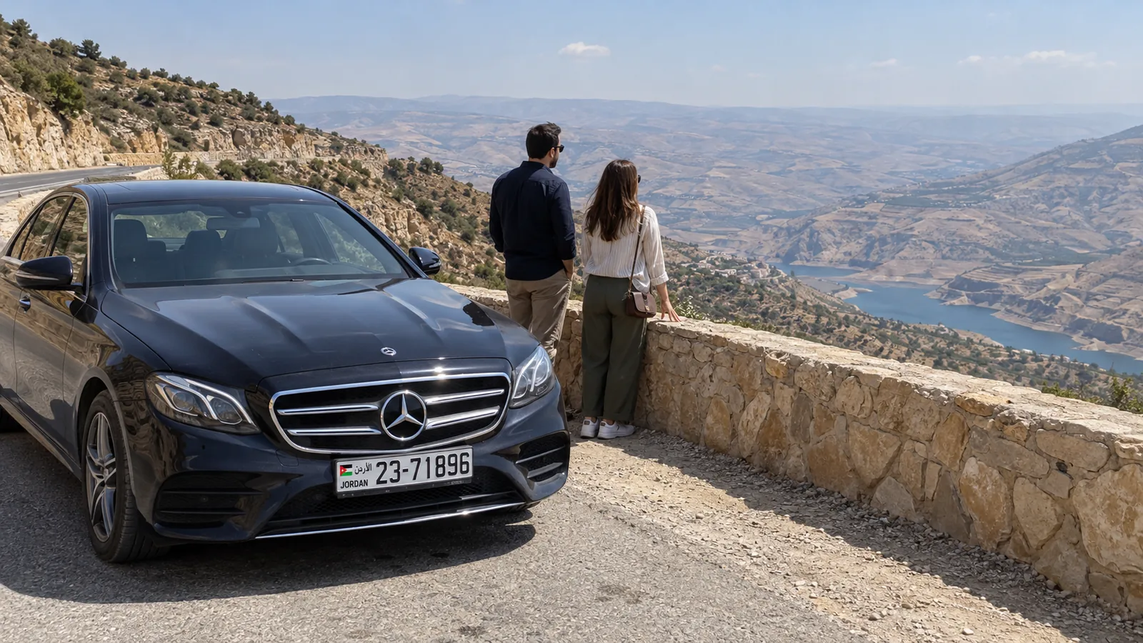 A Mercedes-Benz sedan at a scenic overlook on the King's Highway.
